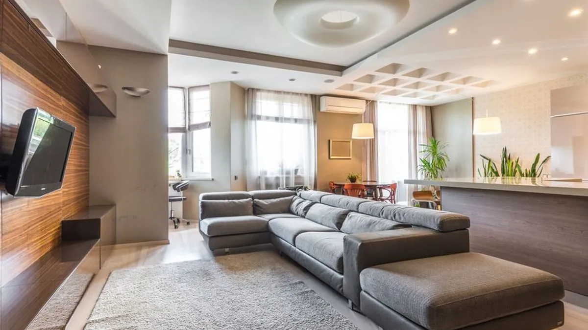 Apartment ceiling with recessed spotlights and a flat board finish