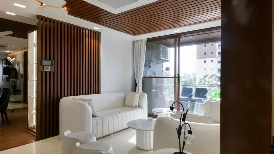 Bright living room in a modern Indian apartment with light walls and open seating