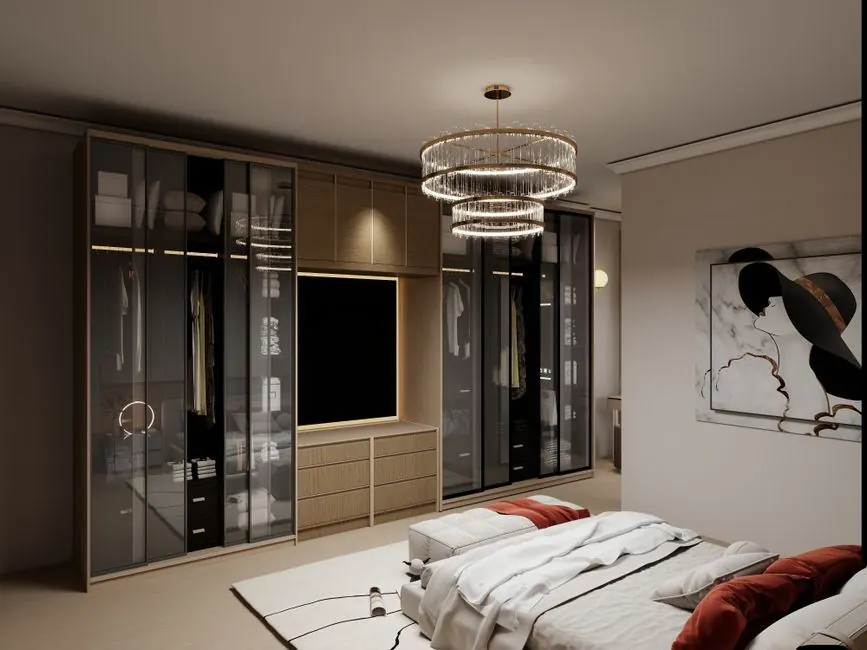 Bedroom wardrobe with glass shutters and lit interior shelves beside a bed